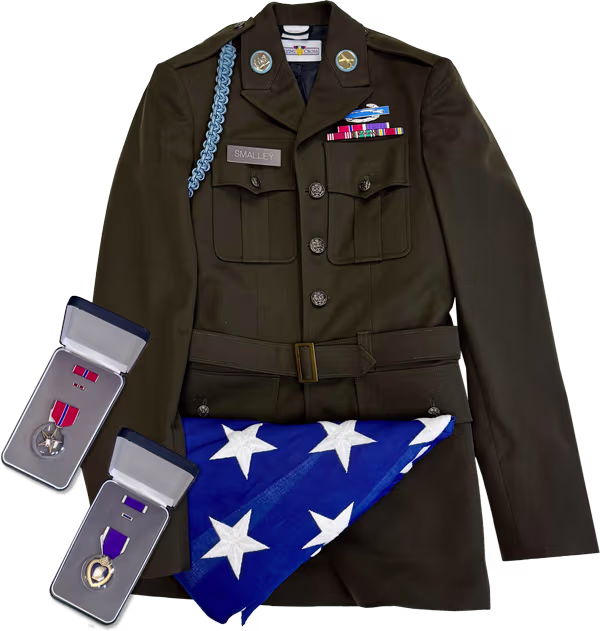 Pvt. Charles Smalley, Jr.'s US Army uniform, medals, and folded flag.